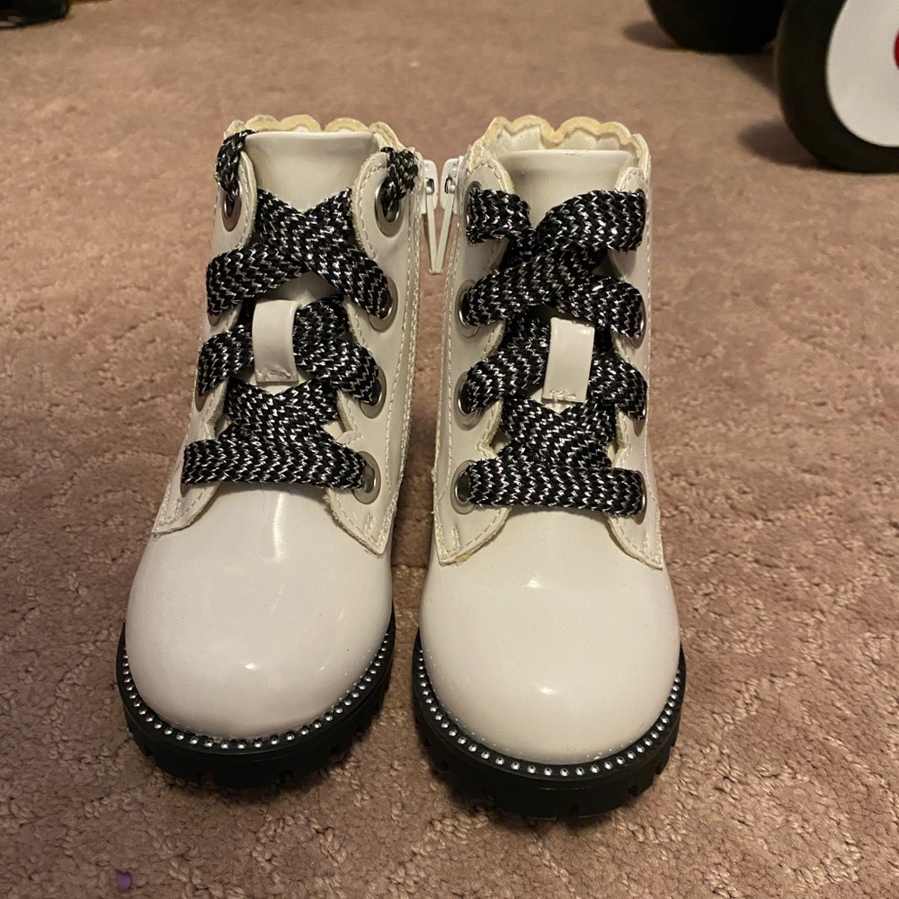 Brand new, never worn white patent leather toddler boots.